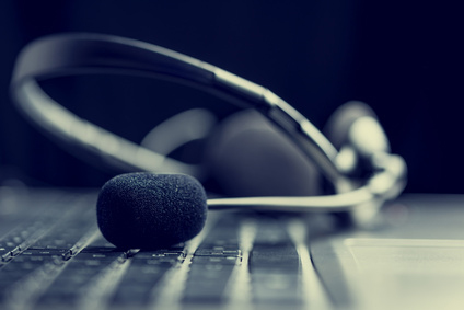 Headset lying on a computer keyboard